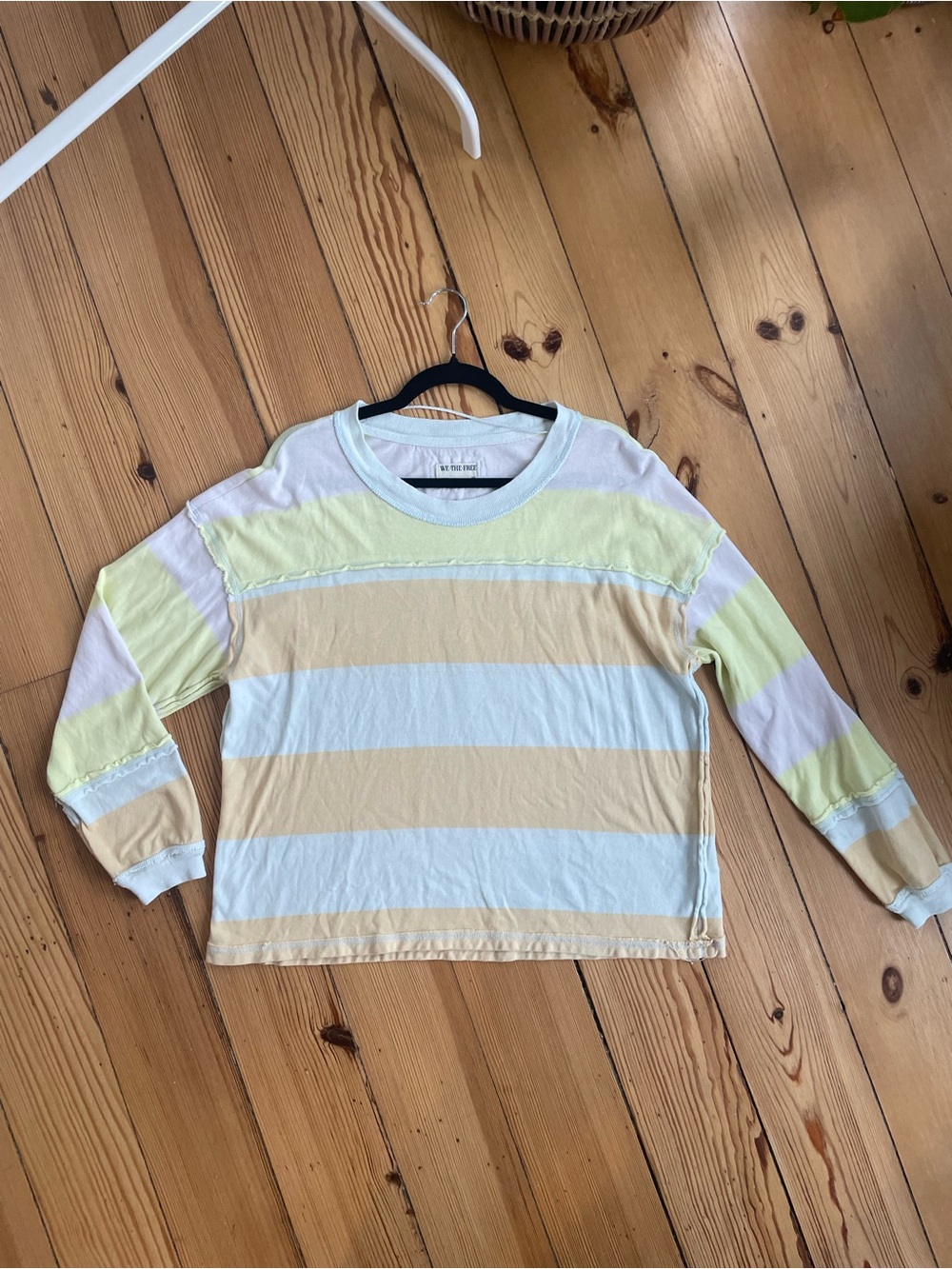 We The Free Pastel Striped Long-Sleeve Tee in Yellow & Cream fits oversized